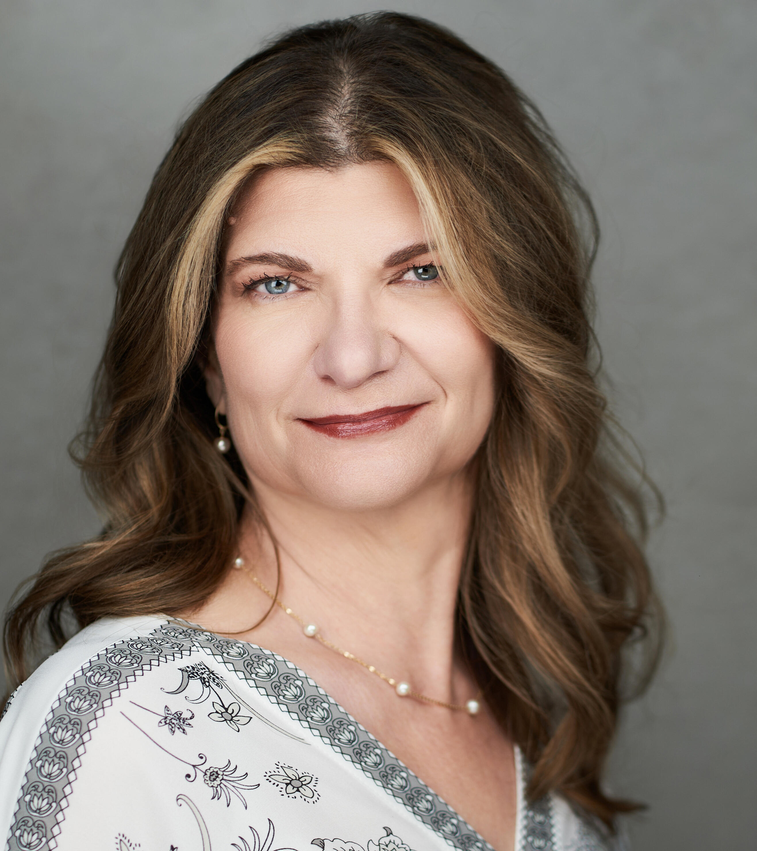 Working with The WhiteCliff Group a desktop layout with notebooks, coffee mug, and pencil case